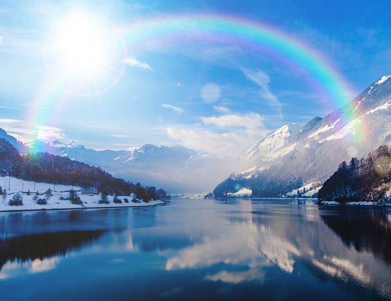 Rainbow over water.