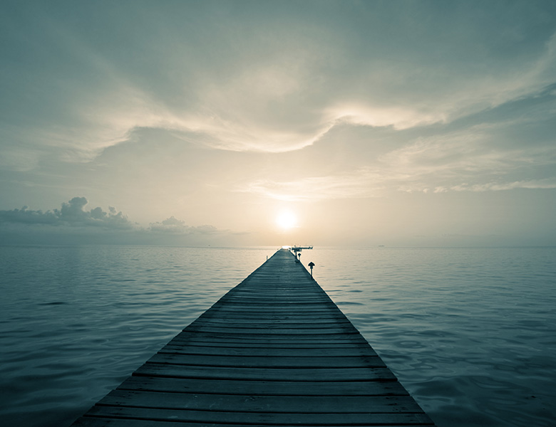 A long dock symbolizing the courage of taking a chance.